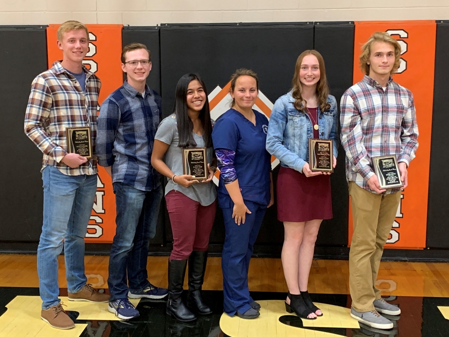 6 students holding plaques